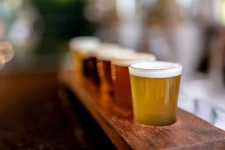 Close-up on a beer tasting sampler at a brewery bar - new experiences concepts